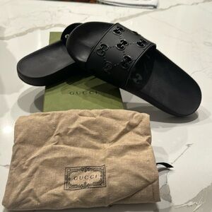 Black rubber slides.   Worn once. With box and dust bag